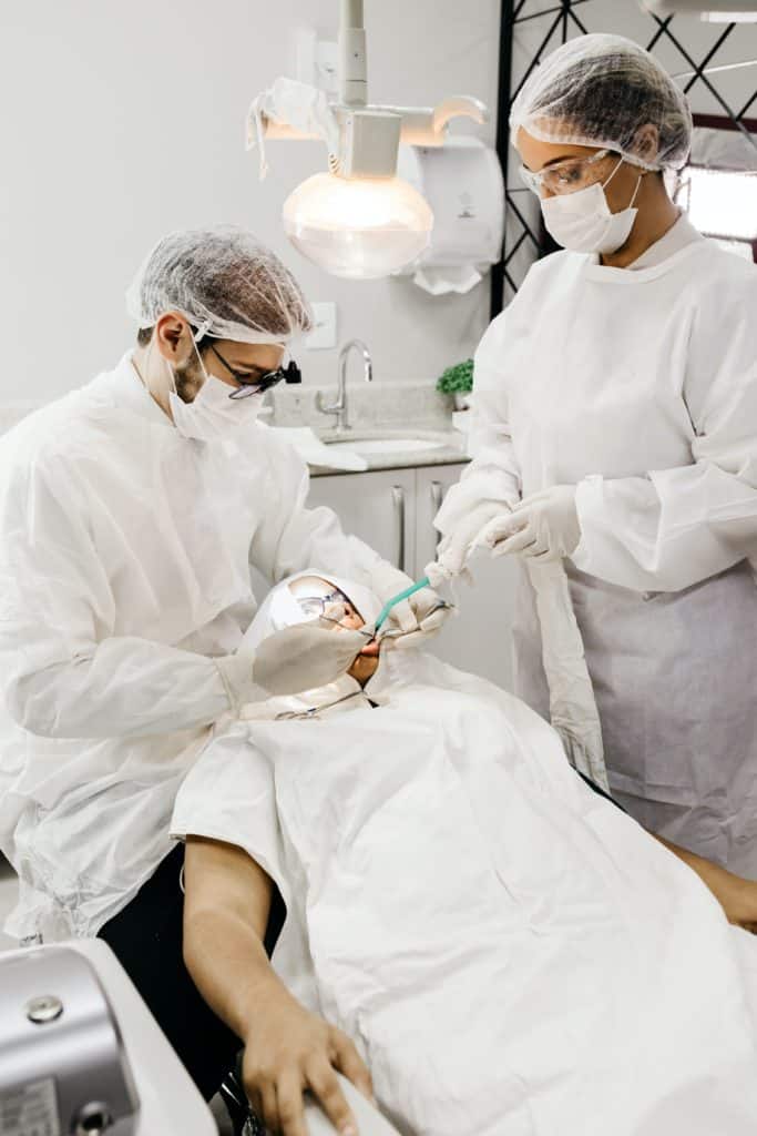 dental assistant working with dentist